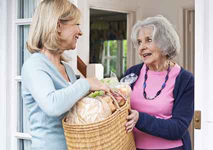Woman receiving meals on wheels service