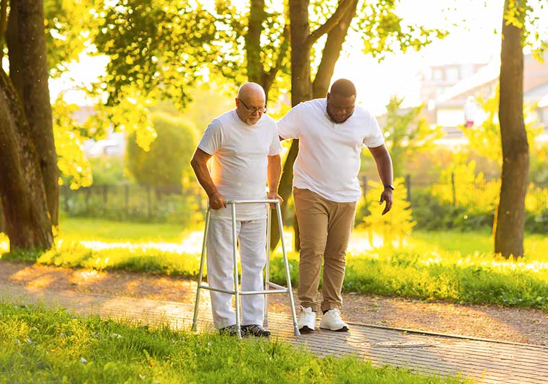 carer and gentleman getting exercise
