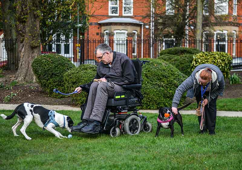 home care provider with client in the park