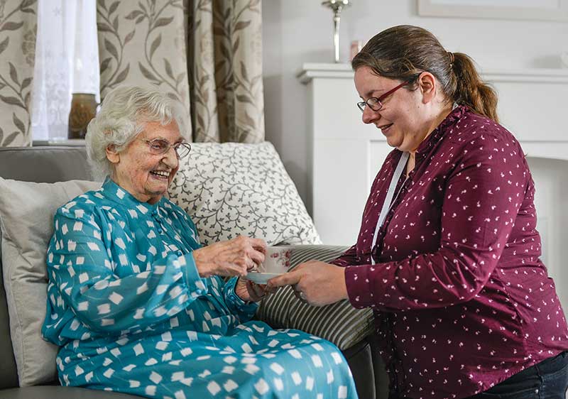 home care Easingwold - carer giving client cup of tea