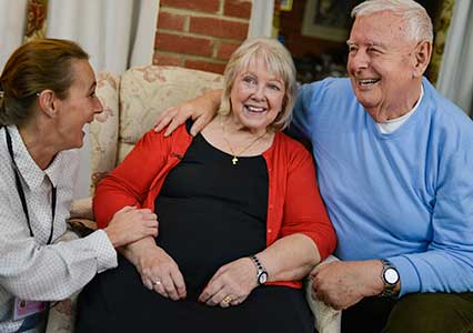 Parkinson's home care - laughing and smiling with client and family