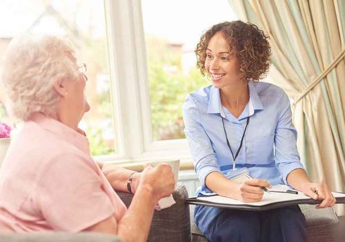 lady and care worker personalising service