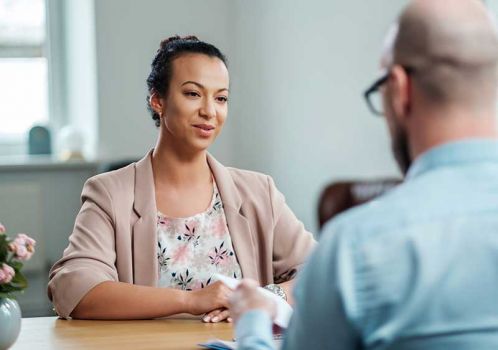 woman attending interview for working in care