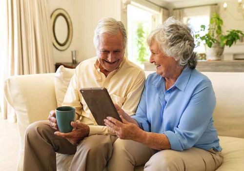 couple looking through home care FAQs