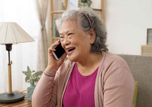 happy woman on the phone getting expert advice