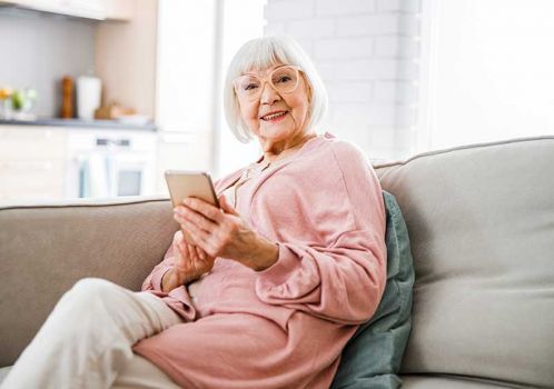 smiling woman happy with care services information