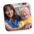 Carer and client laughing together