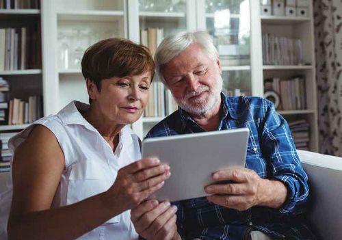 daughter and father reviewing cqc outstanding report